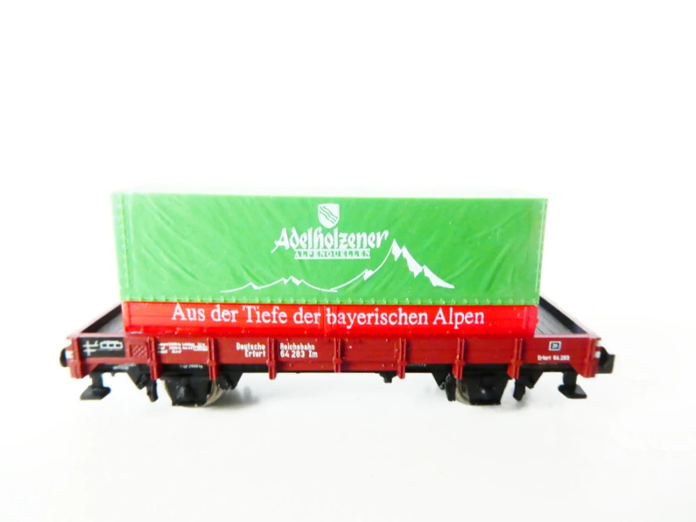 Minitrix 91041 Nízkostěnný vůz 64 283 DR s kontejnerem Adelholzener Alpenquelles TOP STAV