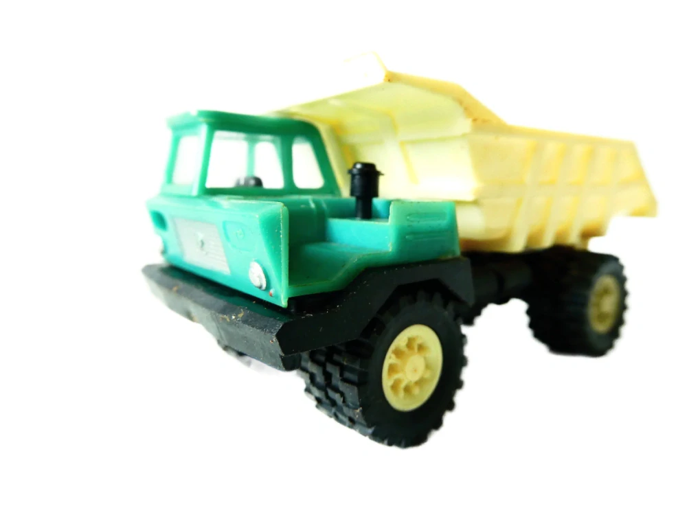 H0 VEB Plastspielwaren Berlin - Nákladní automobil Dumper Perlini v orig. krabičce NA OPRAVU (špatně drží valník)
