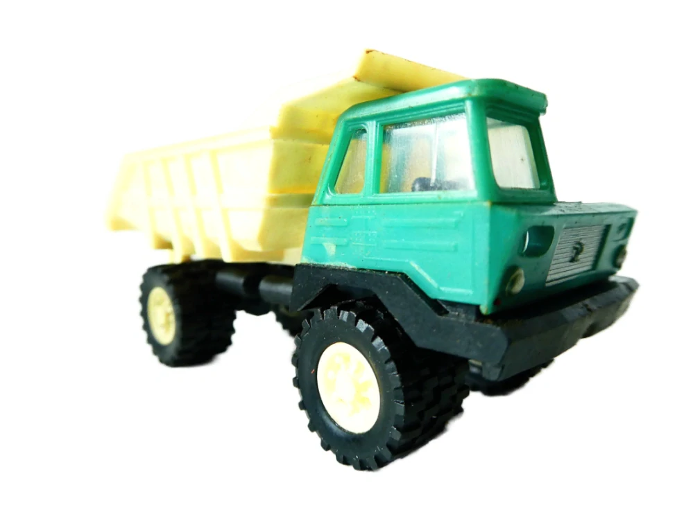 H0 VEB Plastspielwaren Berlin - Nákladní automobil Dumper Perlini v orig. krabičce NA OPRAVU (špatně drží valník)